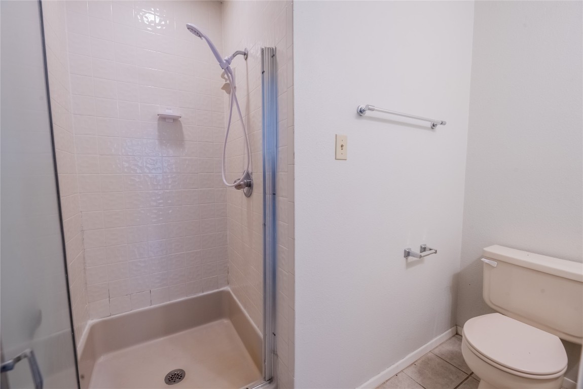 806 West 24th Street, Unit 236 Austin, TX 78705 - Photo 12 of 15 a bathroom with a shower and a toilet