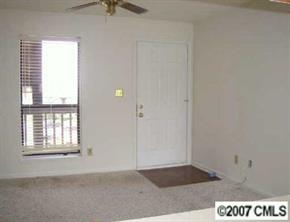 11089 Running Ridge Road, Unit 8493 Charlotte, NC 28226 - Photo 3 of 5 a view of an empty room with a window