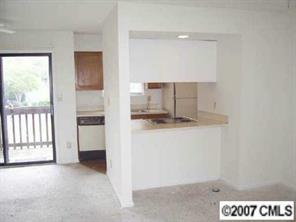 11089 Running Ridge Road, Unit 8493 Charlotte, NC 28226 - Photo 4 of 5 a view of a kitchen with a sink and dishwasher