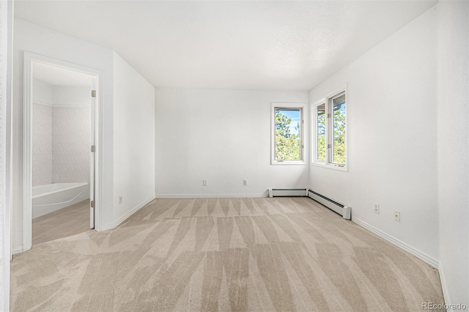 941 Sleepy Hollow Road Golden, CO 80401 - Photo 29 of 50 an empty room with windows