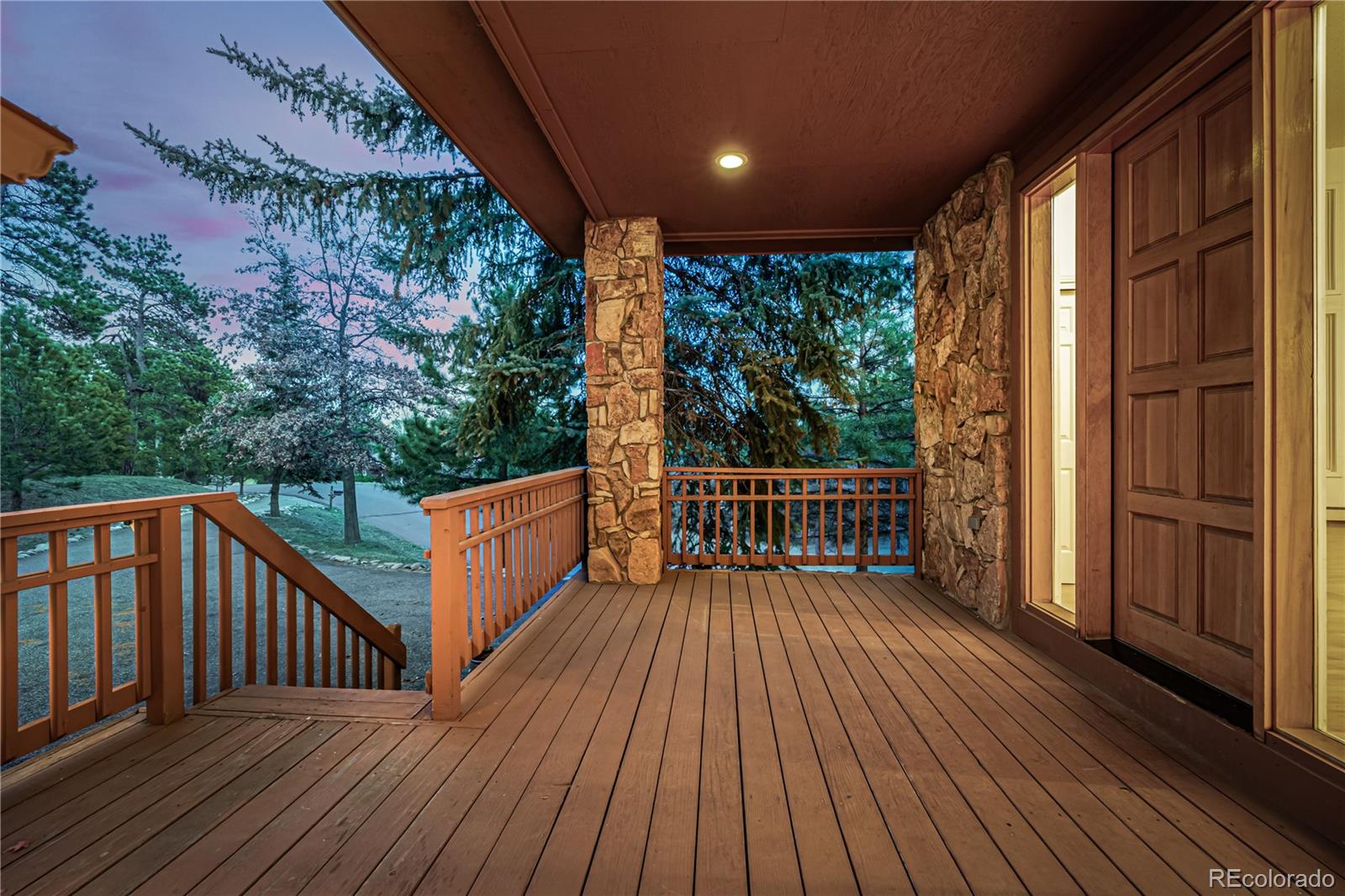 941 Sleepy Hollow Road Golden, CO 80401 - Photo 3 of 50 a balcony with wooden floor and outdoor space