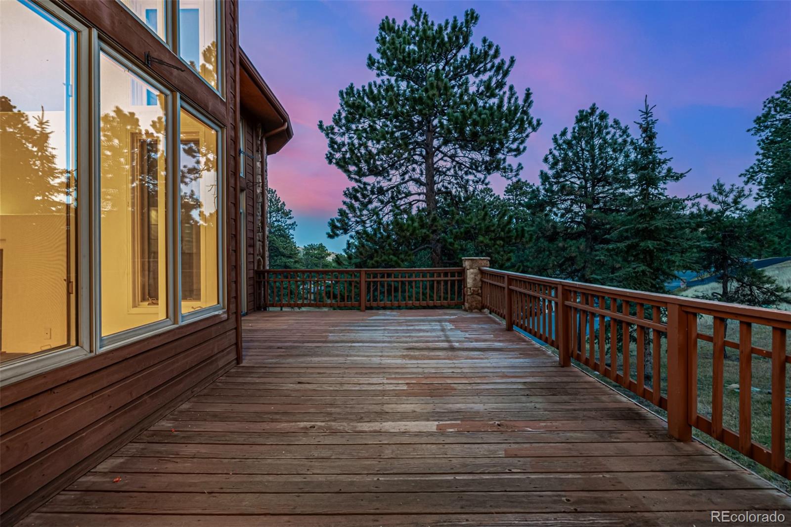 941 Sleepy Hollow Road Golden, CO 80401 - Photo 39 of 50 a view of a balcony with wooden floor and fence