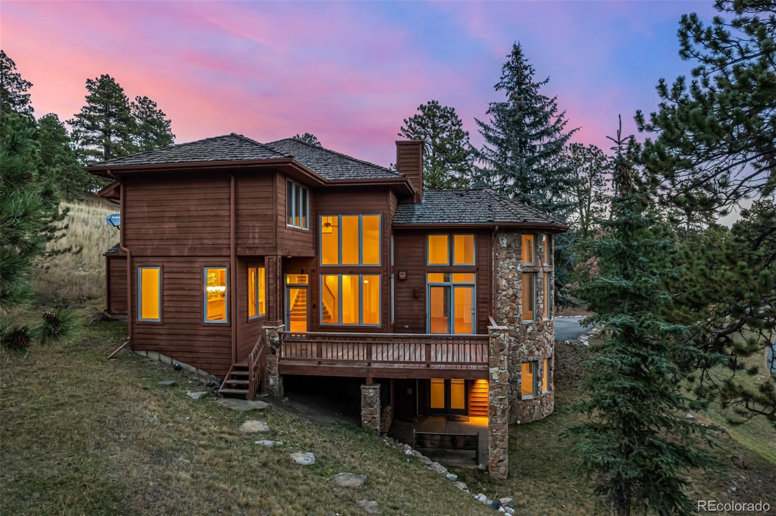 941 Sleepy Hollow Road Golden, CO 80401 - Photo 41 of 50 a front view of a house with a yard