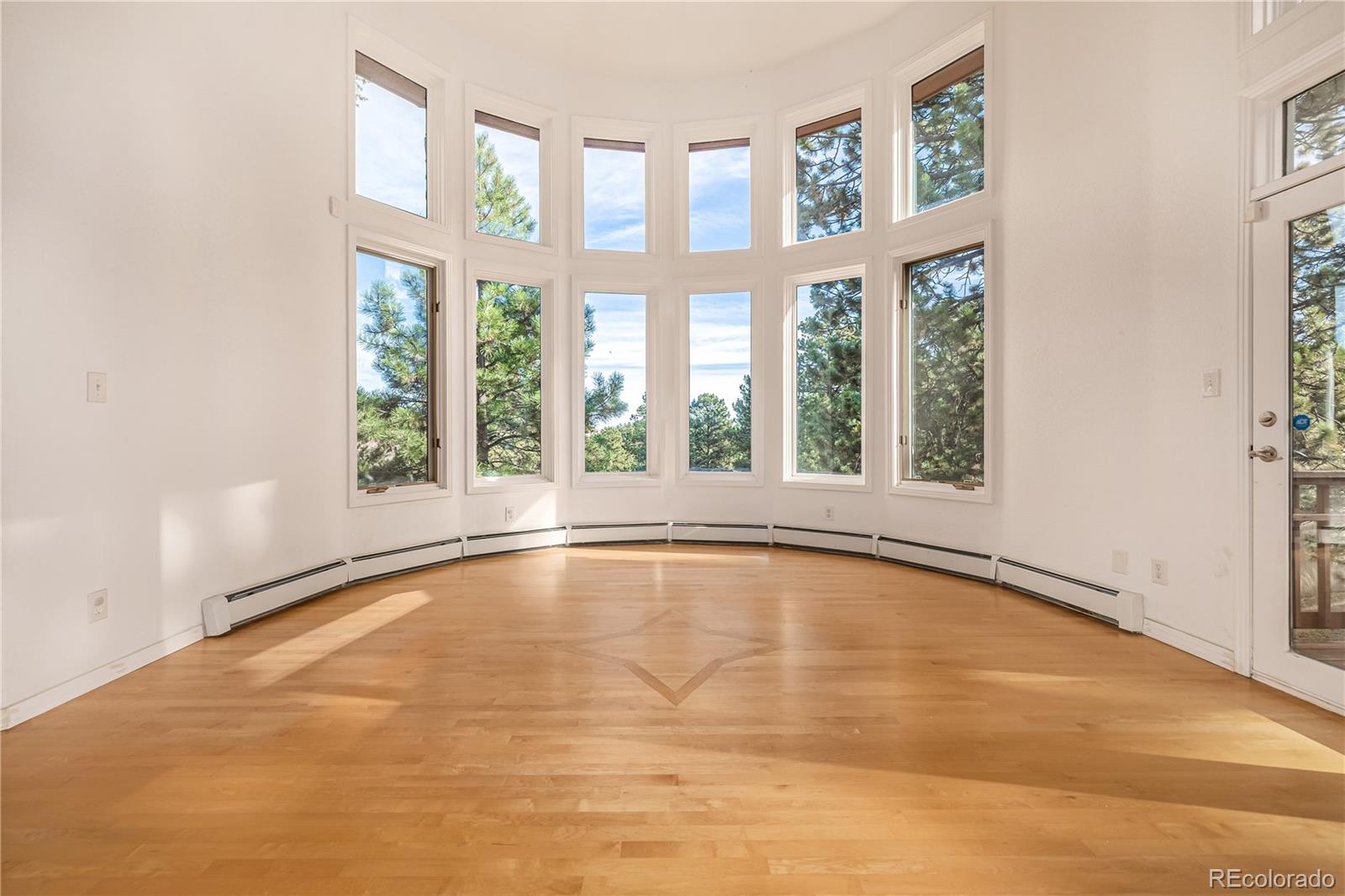 941 Sleepy Hollow Road Golden, CO 80401 - Photo 6 of 50 a view of an empty room with a window and a swimming pool