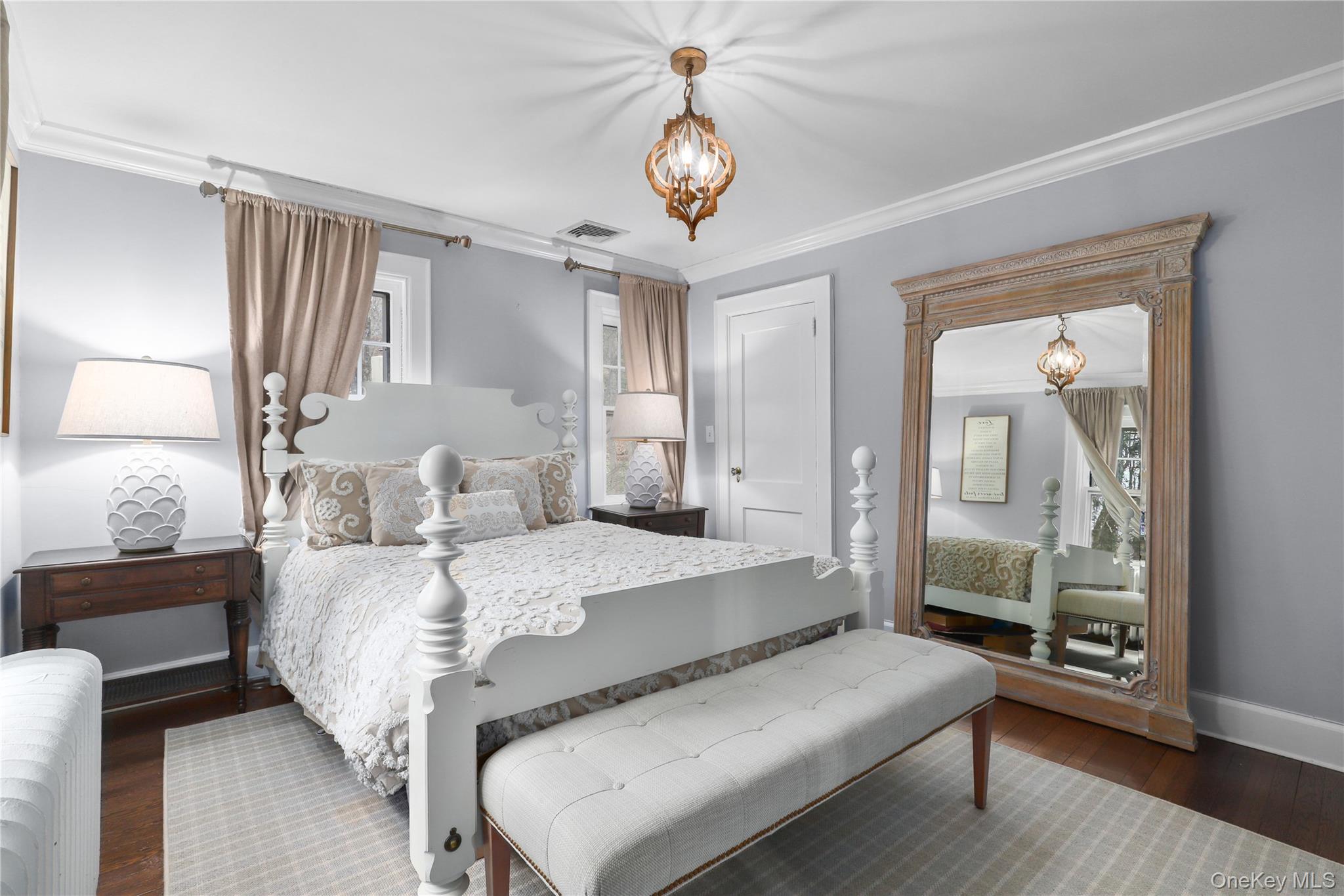 35 Hamilton Road Chappaqua, NY 10514 - Photo 13 of 29 a bedroom with a bed and a chandelier