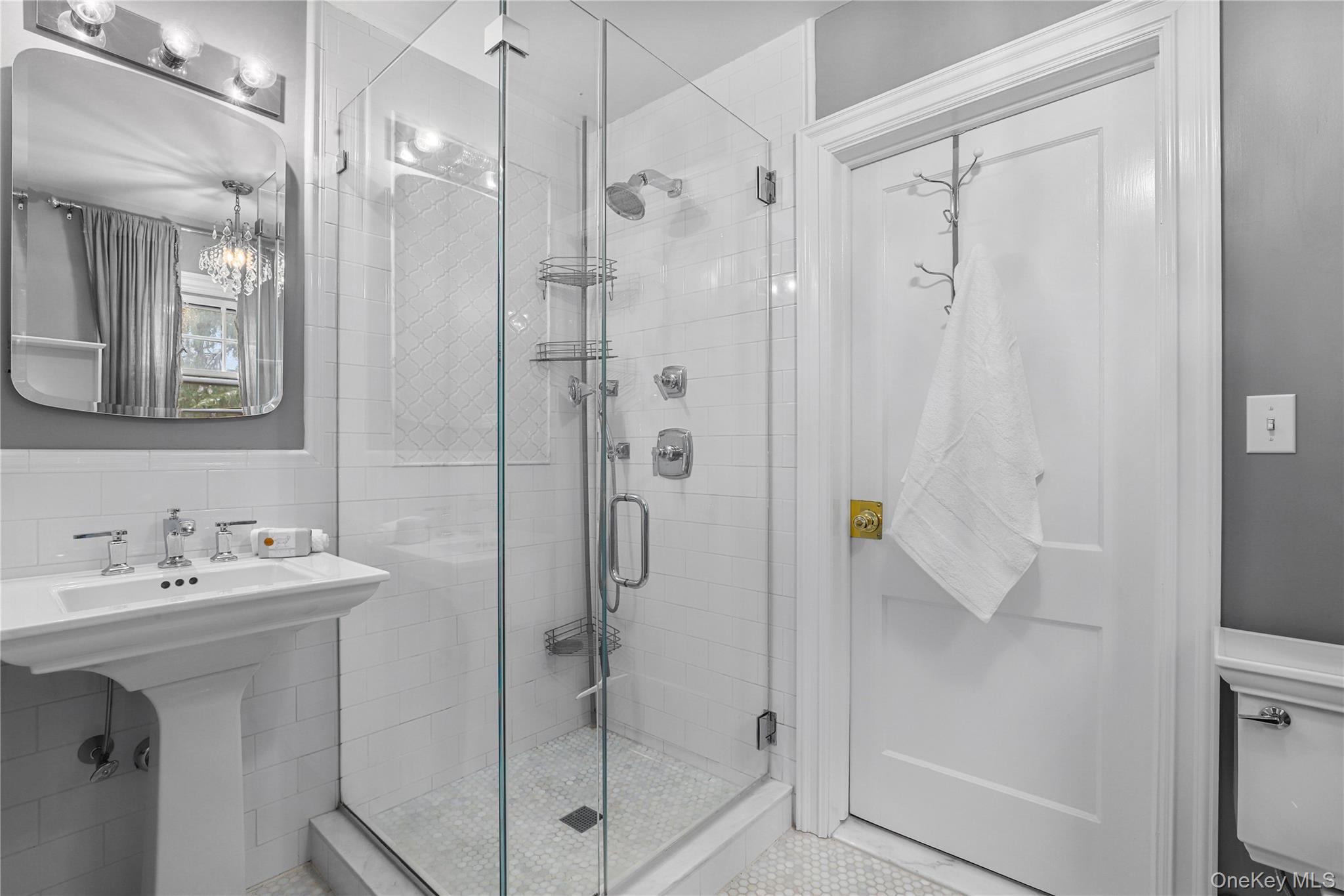 35 Hamilton Road Chappaqua, NY 10514 - Photo 15 of 29 a bathroom with a shower a mirror and a sink