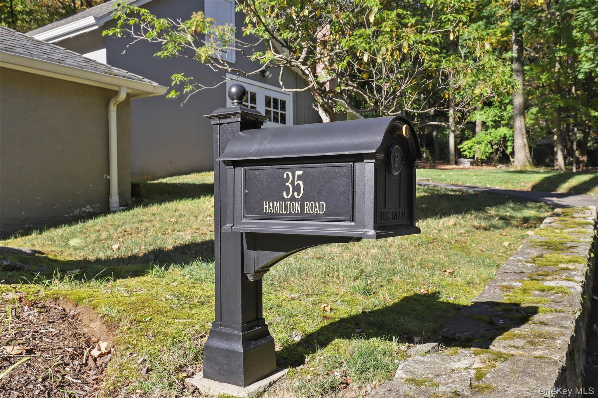 35 Hamilton Road Chappaqua, NY 10514 - Photo 29 of 29 a view of a street sign under a large tree