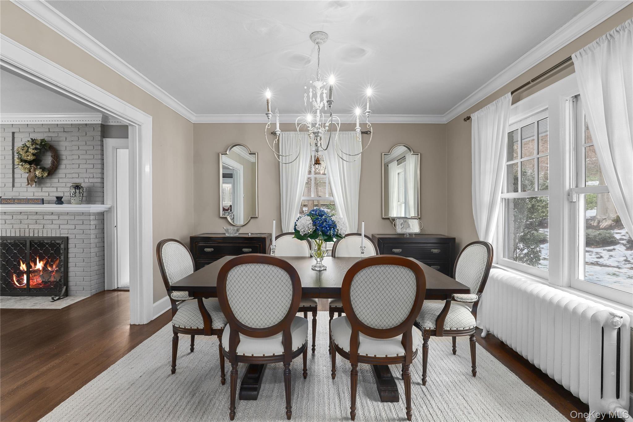 35 Hamilton Road Chappaqua, NY 10514 - Photo 5 of 29 a dining room with furniture a fireplace and wooden floor