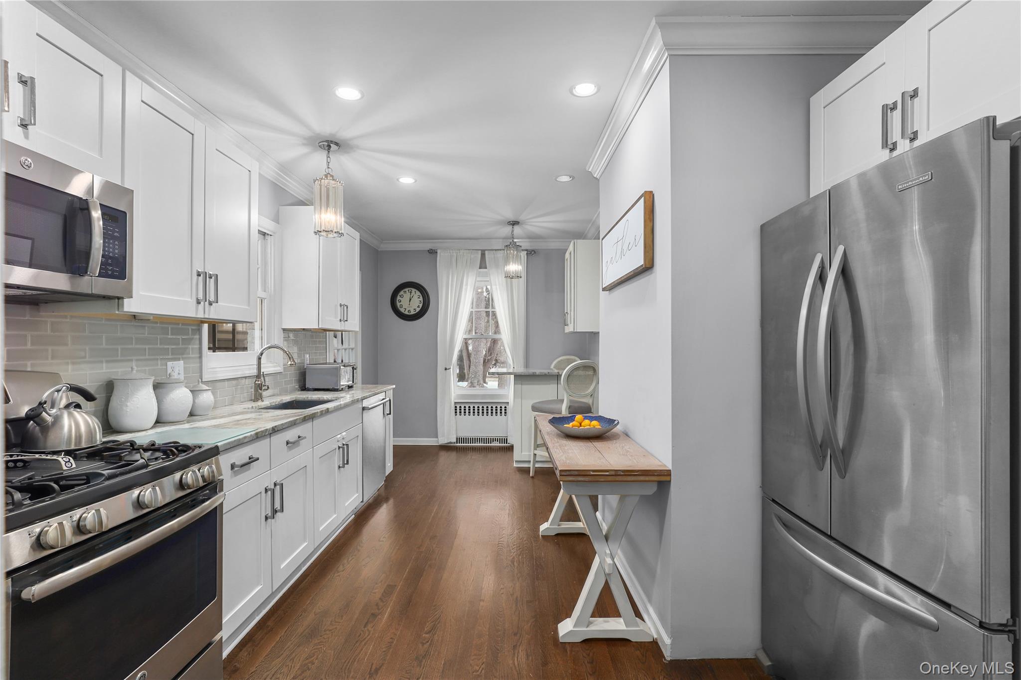35 Hamilton Road Chappaqua, NY 10514 - Photo 7 of 29 a kitchen with refrigerator a stove and wooden floor