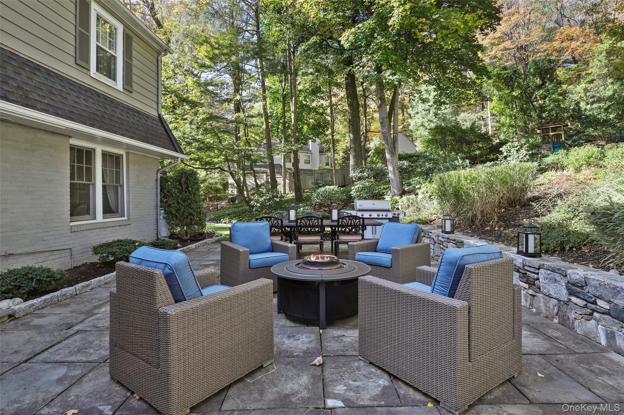35 Hamilton Road Chappaqua, NY 10514 - Photo 9 of 29 a view of a patio with couches and a potted plant on a table