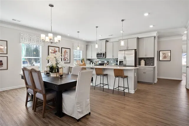 a view of a kitchen counter space a sink and living room view