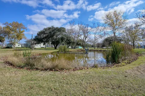 a view of a lake with a yard