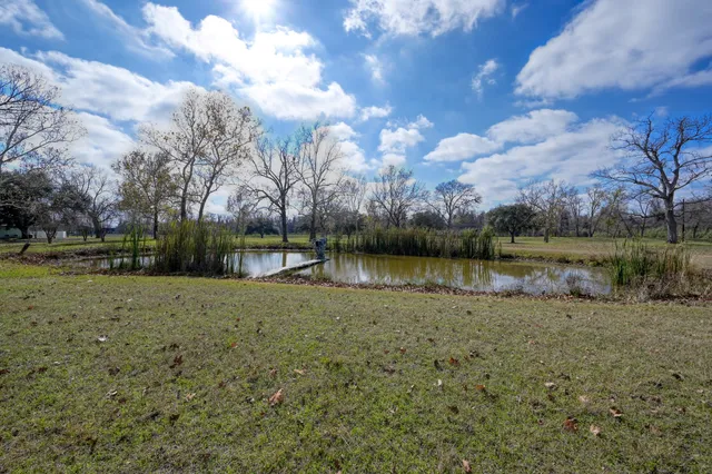 a view of a lake with a yard