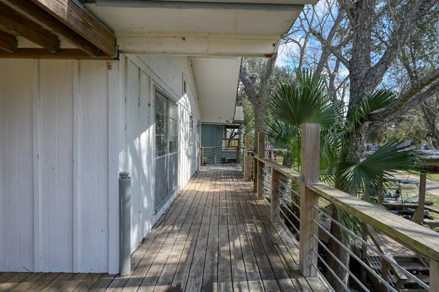 a view of a balcony with wooden floor