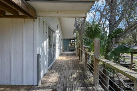 a view of a balcony with wooden floor