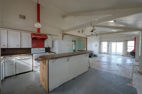 a kitchen with counter top space and cabinets