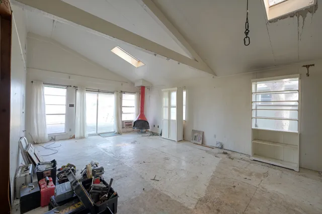 a view of a room with air conditioner and window