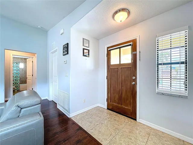 a kitchen with stainless steel appliances granite countertop a stove top oven a sink dishwasher and cabinets with wooden floor