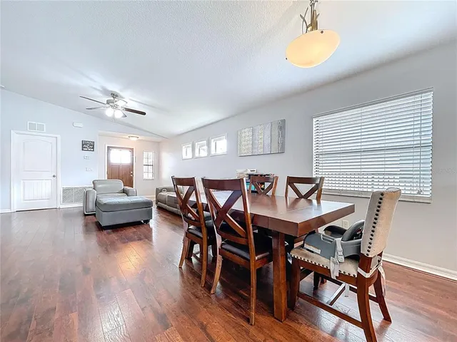 a kitchen with stainless steel appliances granite countertop a refrigerator and a view of cabinet