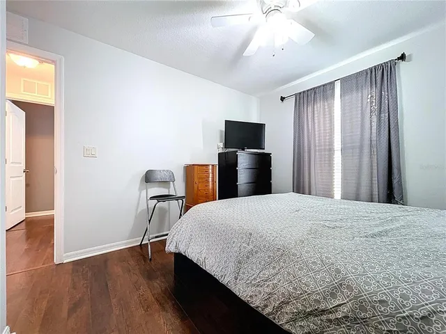 a front view of a house with a garden and yard