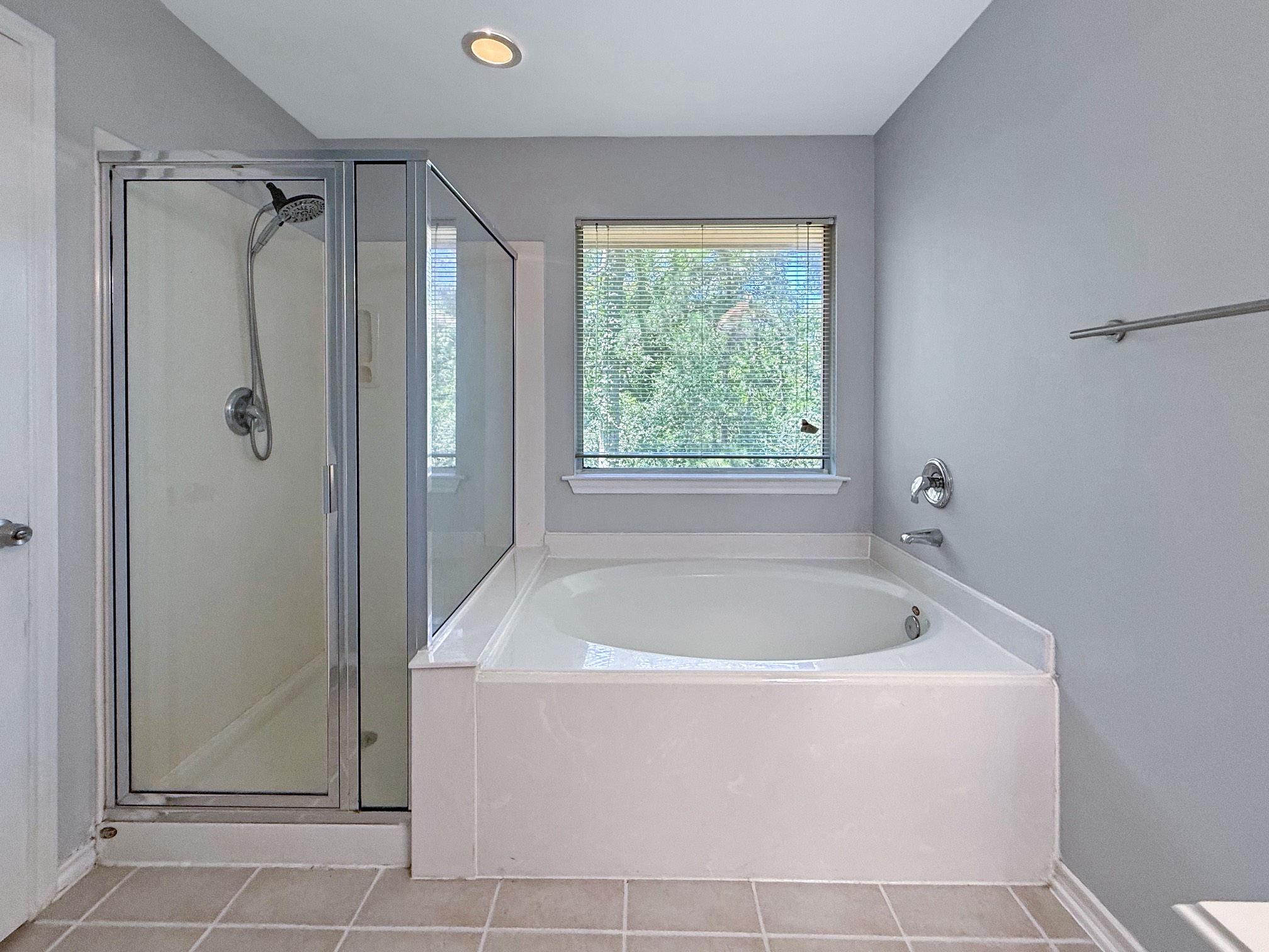 3 Peach Ridge Place The Woodlands, TX 77382 - Photo 15 of 22 a white bath tub sitting next to a shower