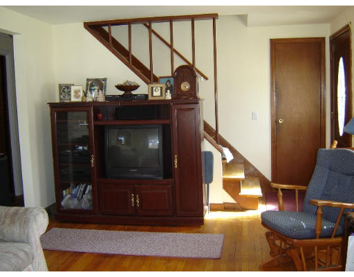 256 Starling Road Springfield, MA 01119 - Photo 4 of 6 a view of entryway and hall with wooden floor