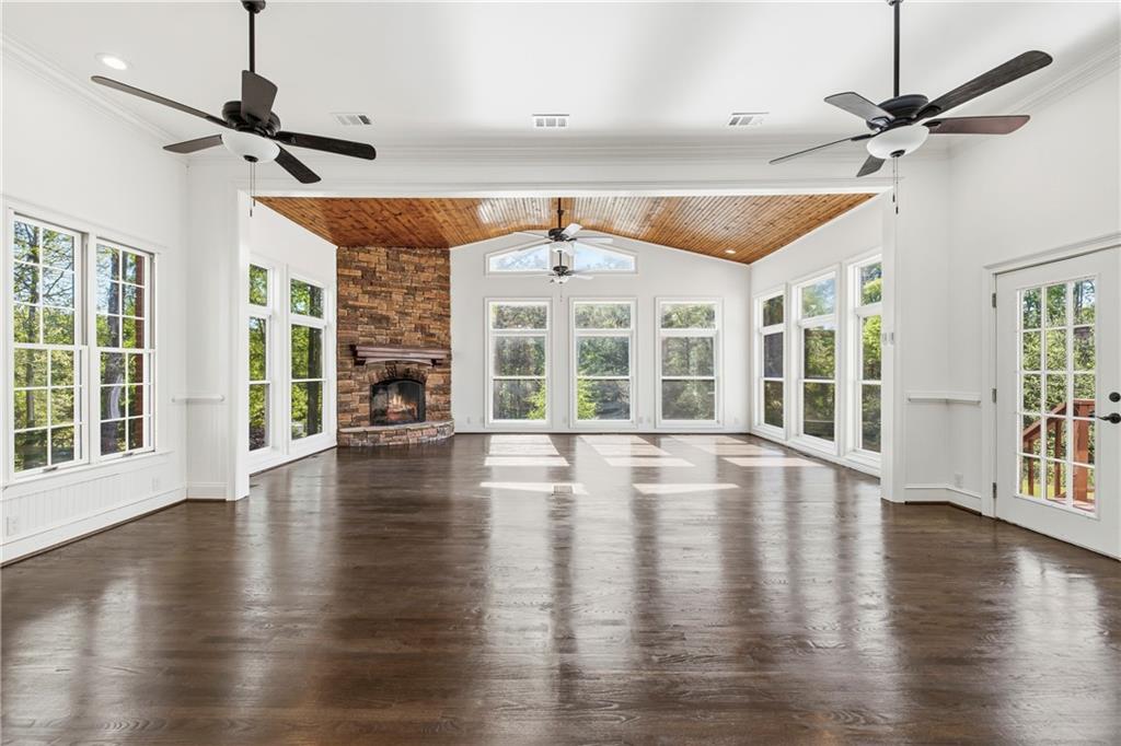 2240 Wilzman Trail Conyers, GA 30012 - Photo 19 of 72 a view of an room with wooden floor fireplace and windows