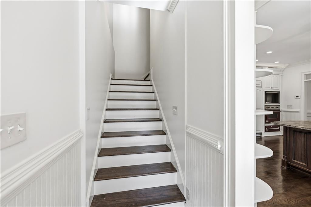 2240 Wilzman Trail Conyers, GA 30012 - Photo 28 of 72 a view of a hallway with wooden floor and entryway