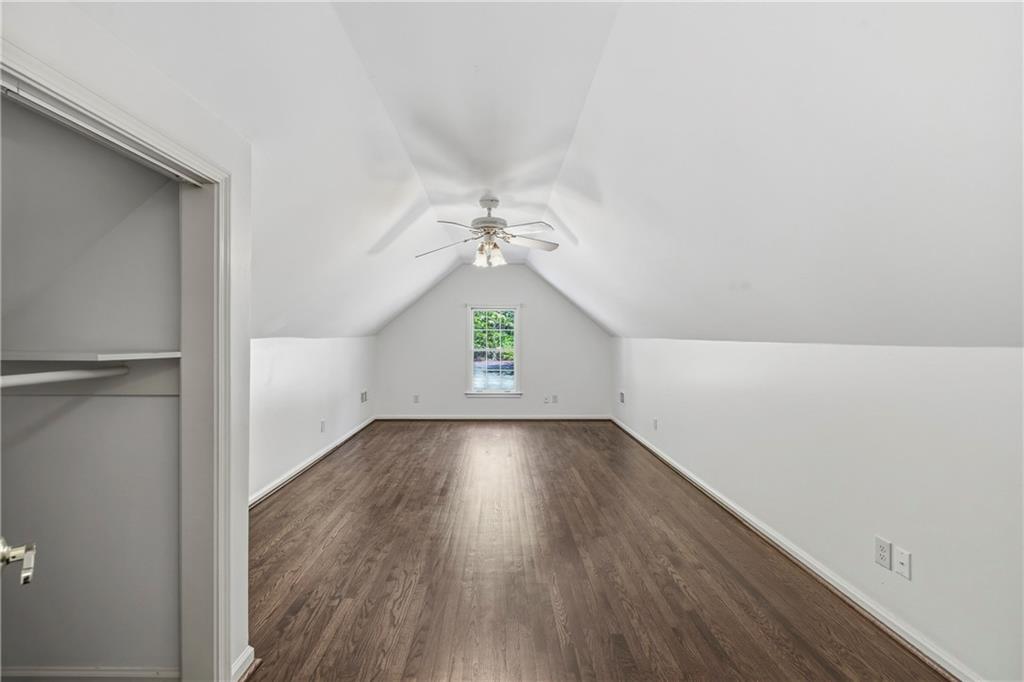 2240 Wilzman Trail Conyers, GA 30012 - Photo 29 of 72 a view of an empty room with wooden floor and a window