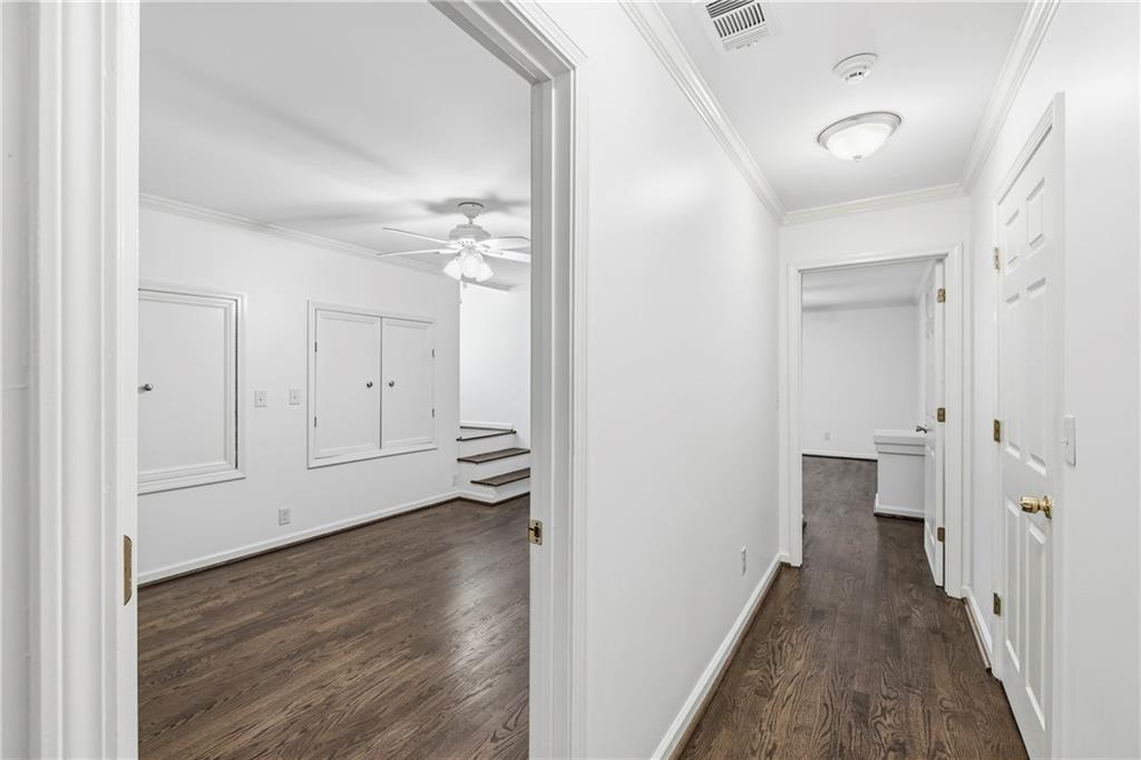 2240 Wilzman Trail Conyers, GA 30012 - Photo 31 of 72 a view of a hallway with wooden floor