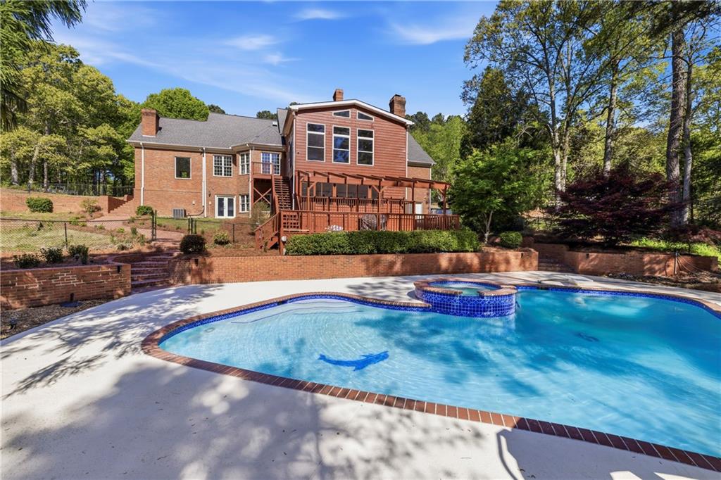 2240 Wilzman Trail Conyers, GA 30012 - Photo 55 of 72 a view of a house with swimming pool