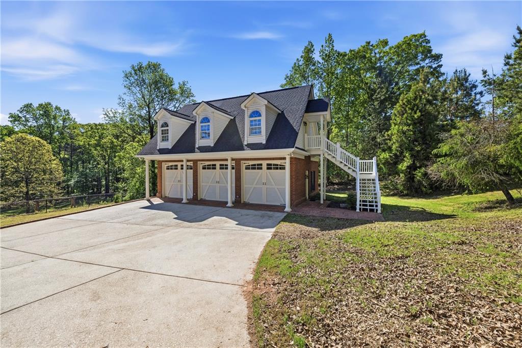 2240 Wilzman Trail Conyers, GA 30012 - Photo 58 of 72 a front view of a house with garden
