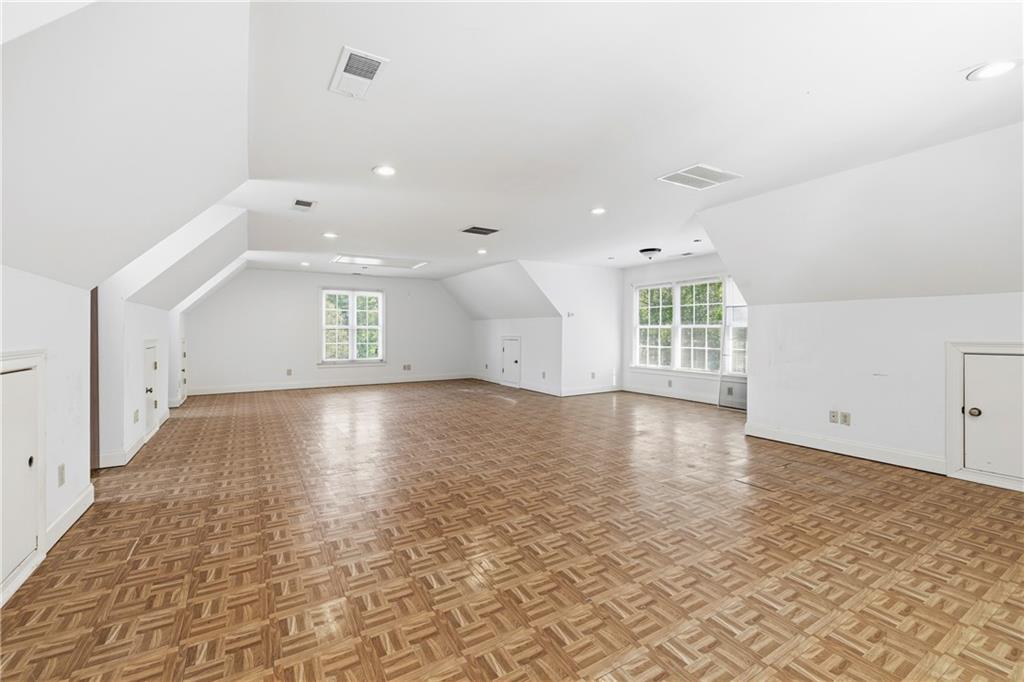 2240 Wilzman Trail Conyers, GA 30012 - Photo 60 of 72 an empty room with wooden floor and windows