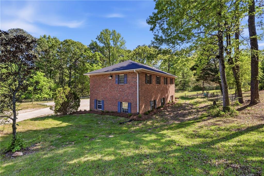 2240 Wilzman Trail Conyers, GA 30012 - Photo 62 of 72 a view of a house with a yard