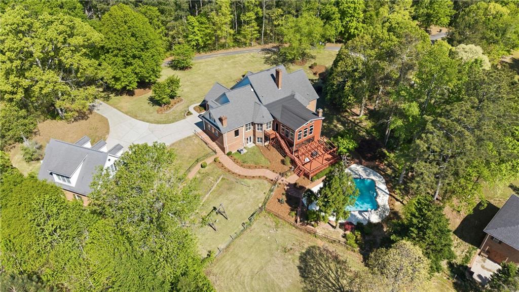 2240 Wilzman Trail Conyers, GA 30012 - Photo 71 of 72 an aerial view of a house with a yard and swimming pool
