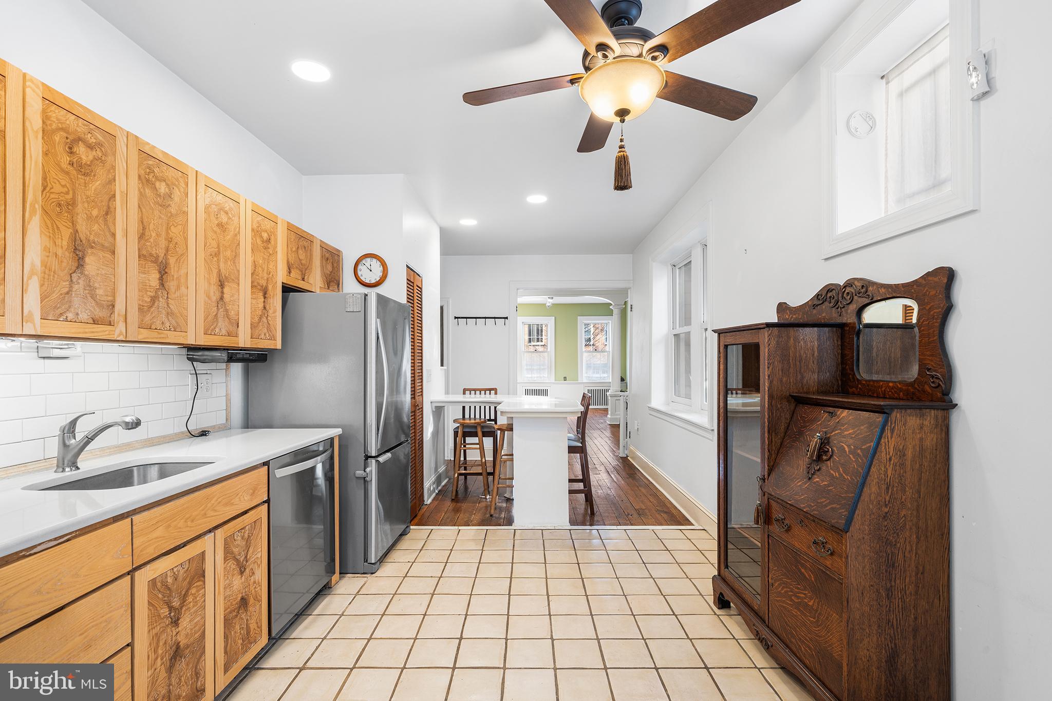 705 South Warnock Street Philadelphia, PA 19147 - Photo 12 of 28 a kitchen with stainless steel appliances a sink a stove a refrigerator cabinets and furniture