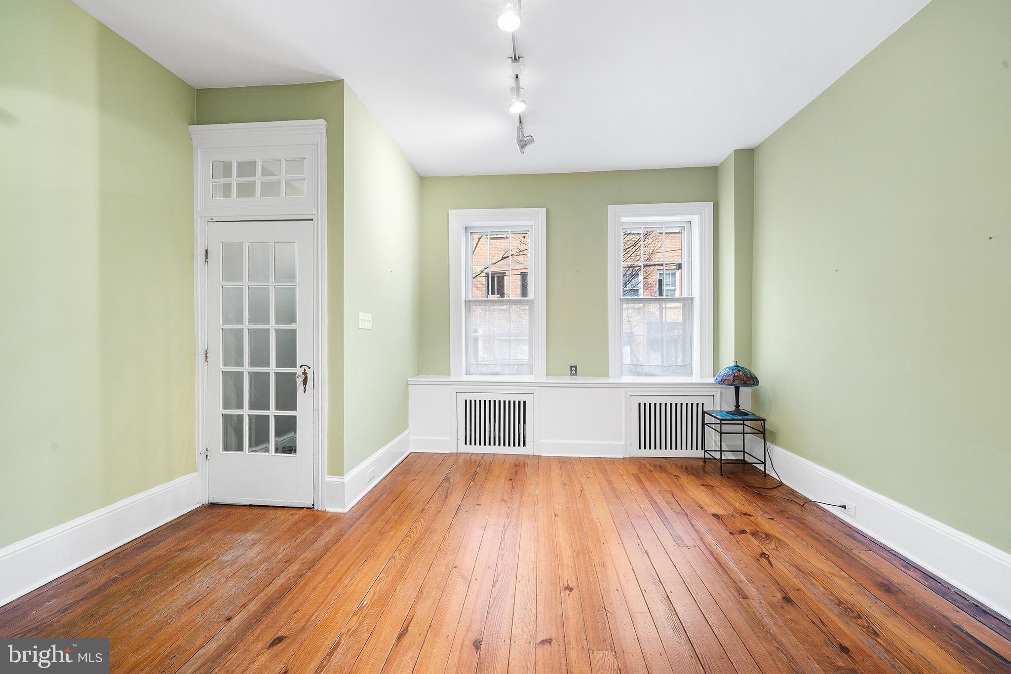 705 South Warnock Street Philadelphia, PA 19147 - Photo 15 of 28 a view of empty room with wooden floor and fan