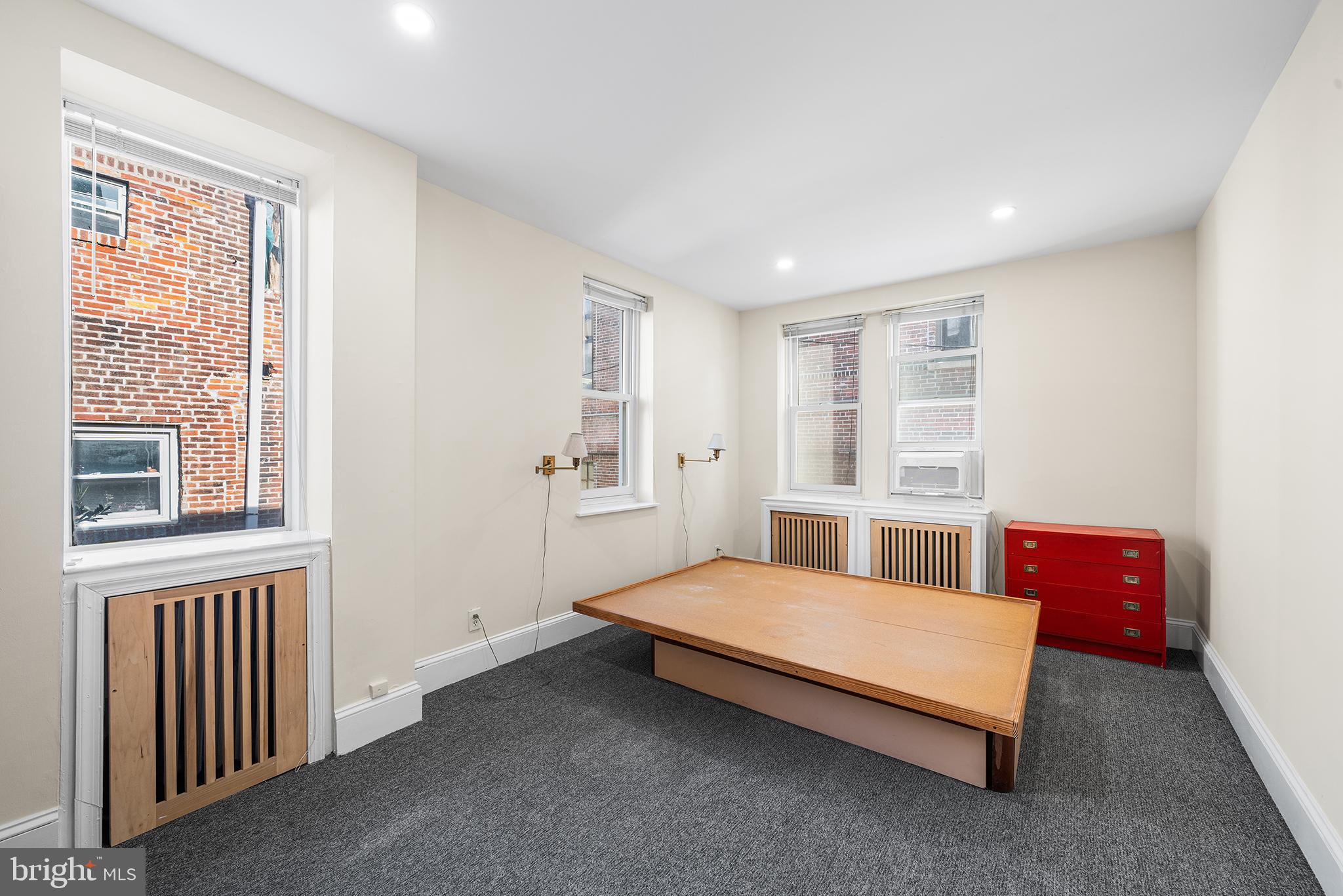 705 South Warnock Street Philadelphia, PA 19147 - Photo 20 of 28 a bedroom with furniture and windows