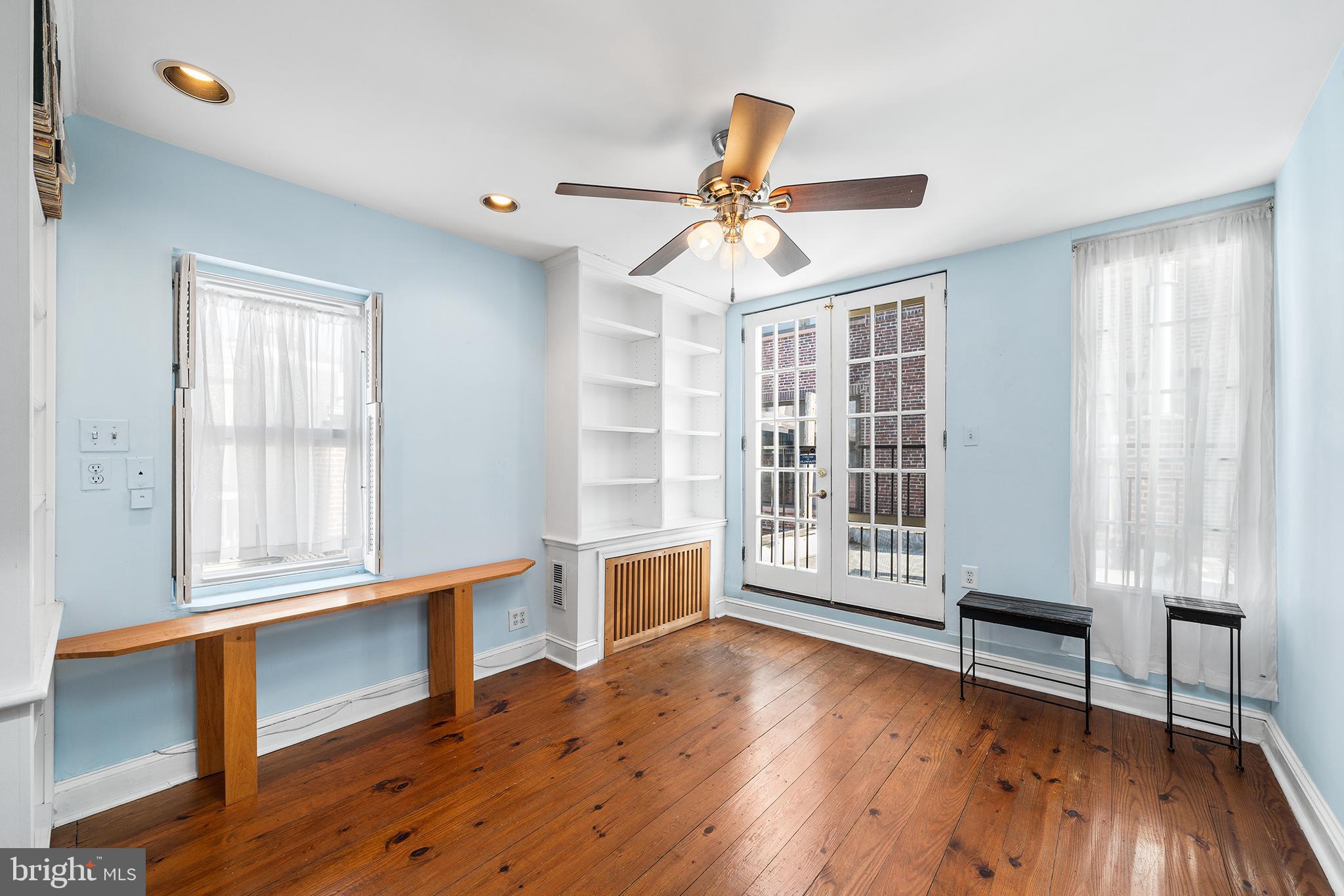705 South Warnock Street Philadelphia, PA 19147 - Photo 23 of 28 a view of an empty room with a window and wooden floor