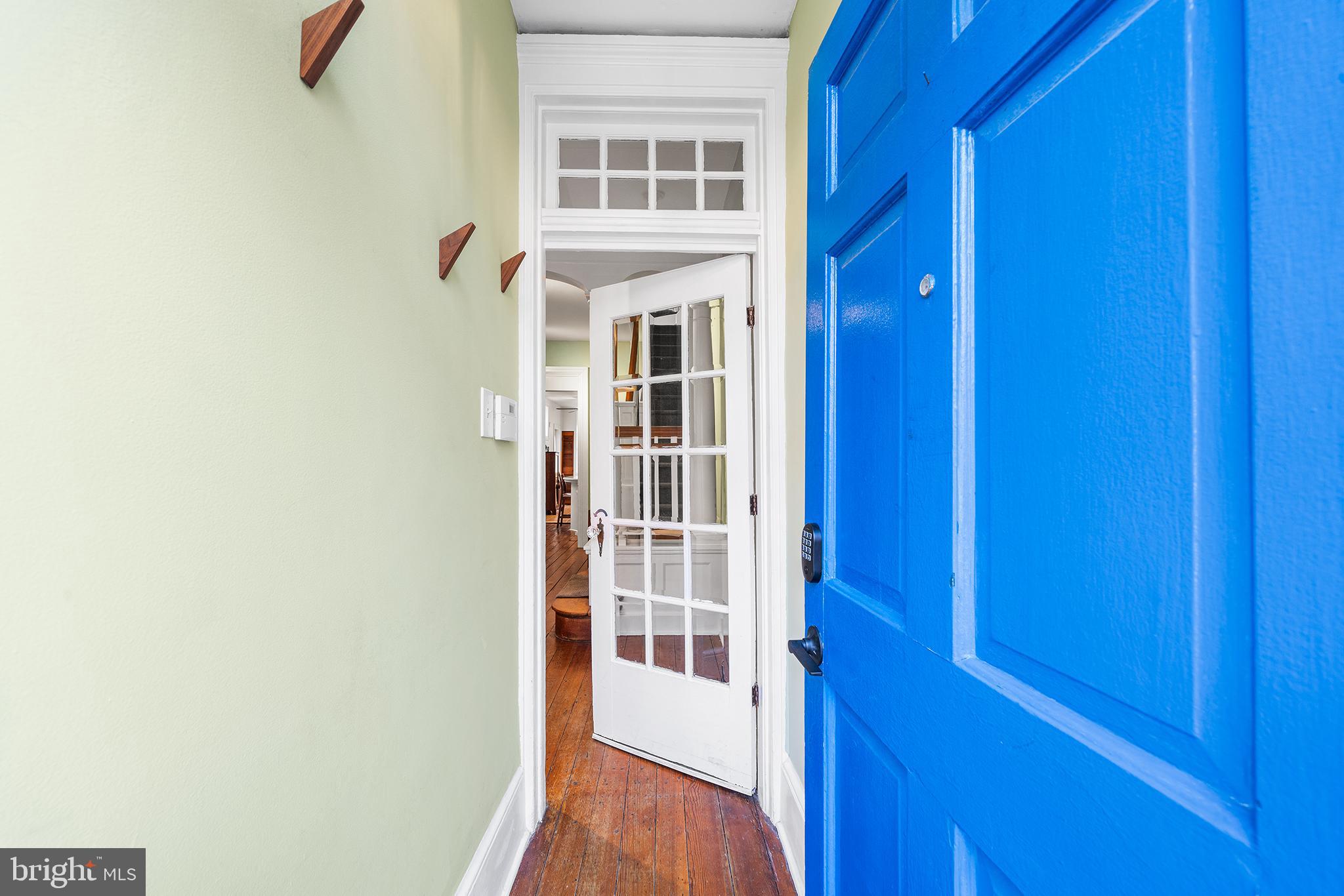 705 South Warnock Street Philadelphia, PA 19147 - Photo 3 of 28 a view of a hallway with wooden floor and windows