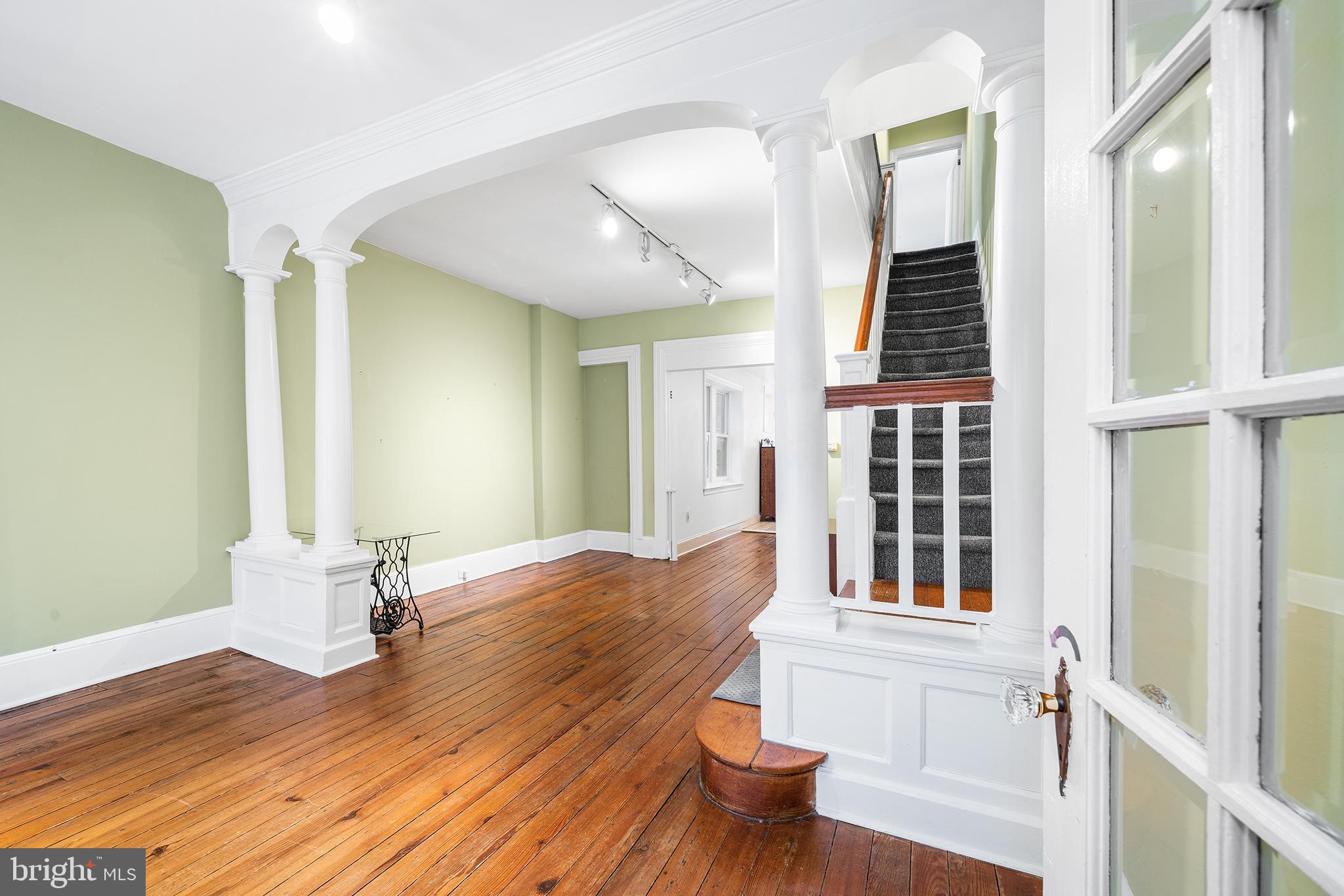 705 South Warnock Street Philadelphia, PA 19147 - Photo 4 of 28 a view of empty room with wooden floor and fan