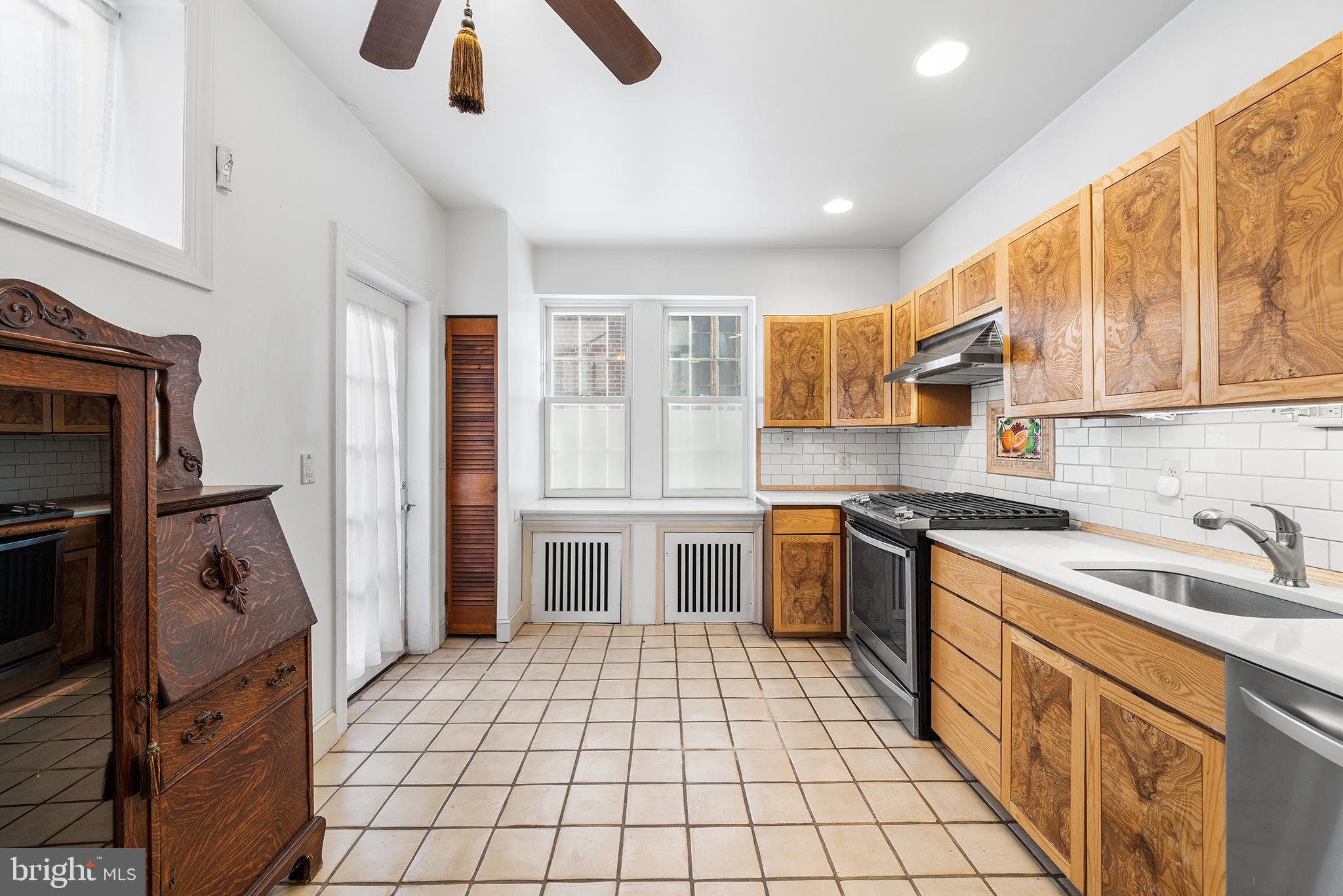 705 South Warnock Street Philadelphia, PA 19147 - Photo 8 of 28 a kitchen with a sink appliances and cabinets