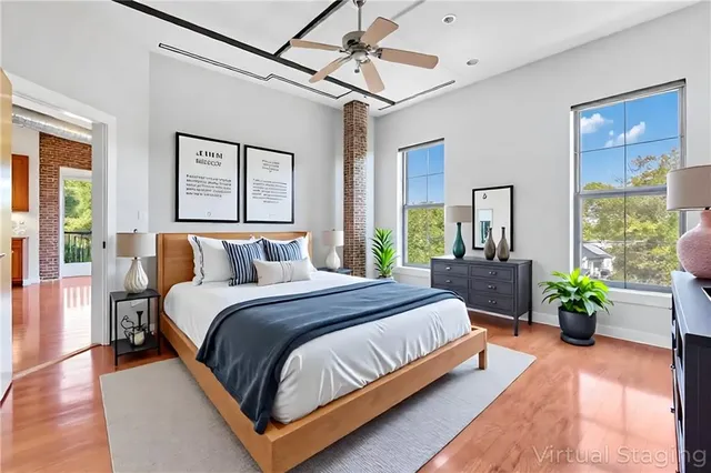 a bedroom with bed and balcony