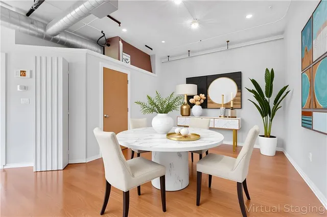a view of a dining room with furniture and wooden floor