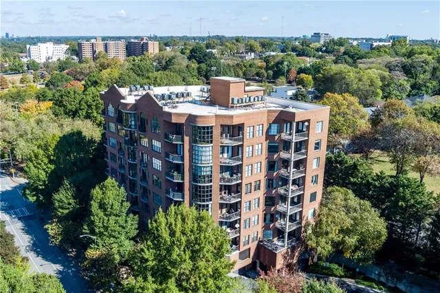 front view of a building with a garden