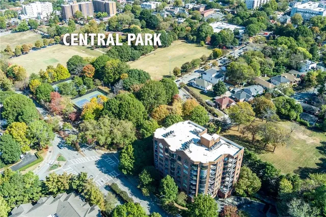 an aerial view of a house with a yard and garden