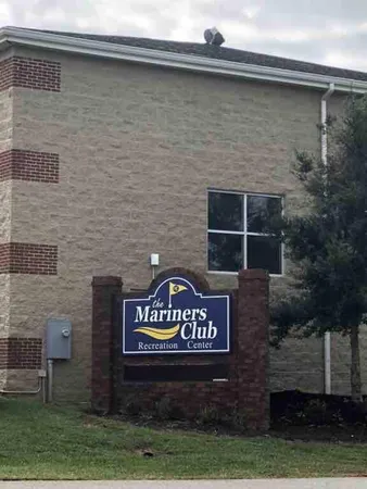 a view of a lake with boats and trees