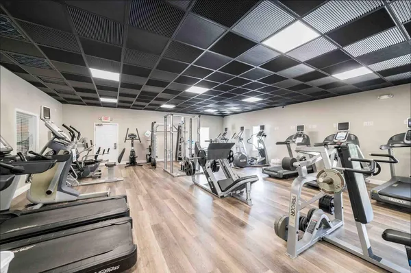 an aerial view of a house with a garden and lake view