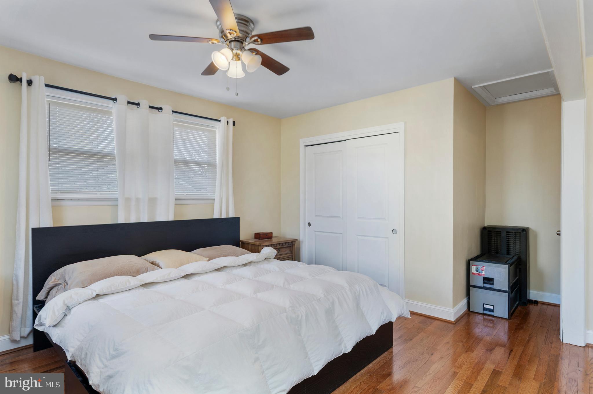 123 Walnut Street Northwest Washington, DC 20012 - Photo 21 of 59 a bedroom with a bed and a table