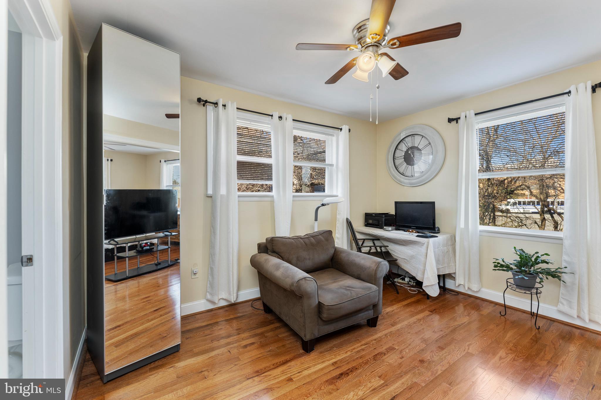 123 Walnut Street Northwest Washington, DC 20012 - Photo 24 of 59 a living room with furniture a flat screen tv and a window